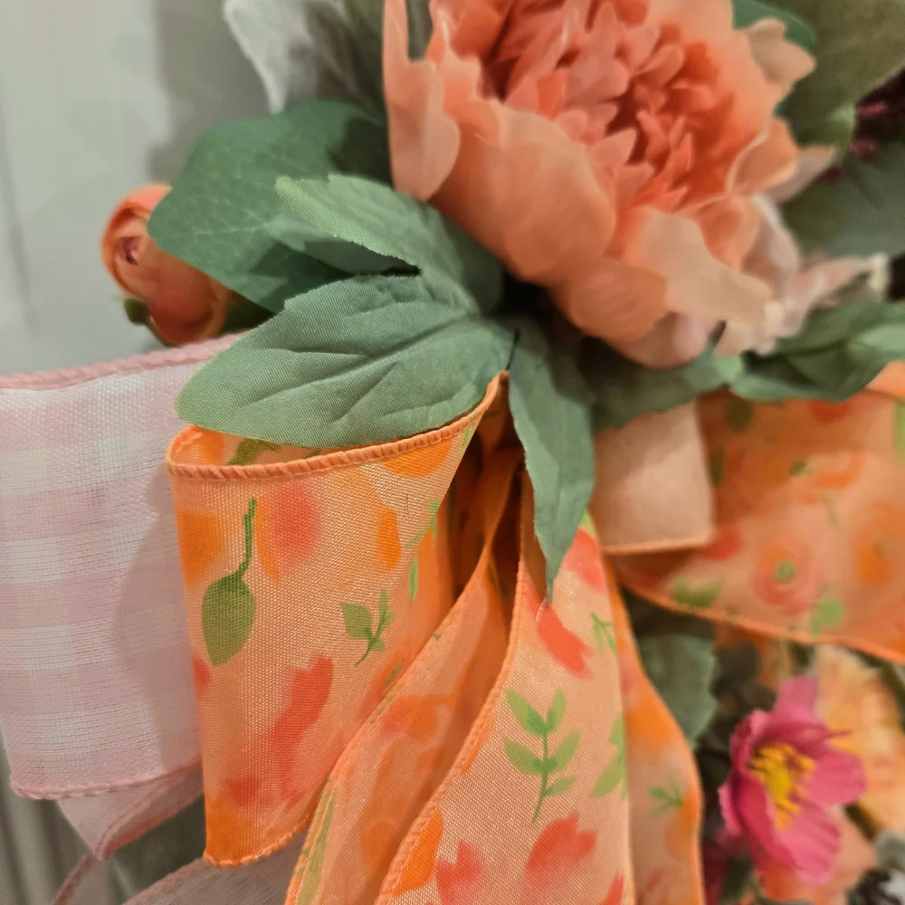Peach and Pink Holiday Wreath with Festive Ribbon